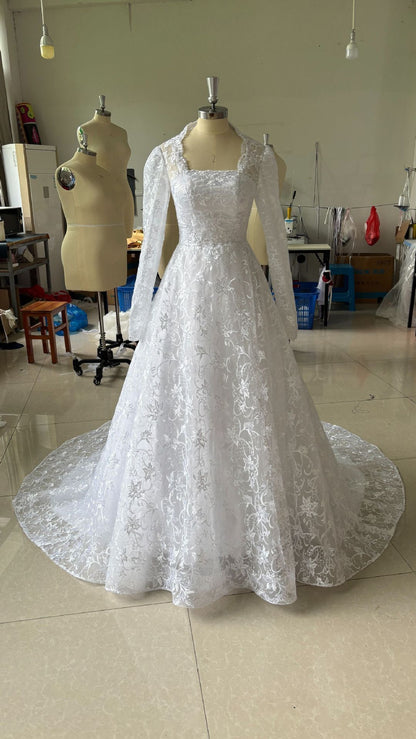 Embroidered Long Sleeve Trailing Wedding Dress GlamzKart